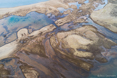 Sandbanks at the end of a fjord in the Westfjords of Iceland - looking like a ghost in the water. Aerial photo captured by drone.