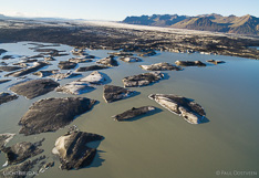 Floating icebergs in front of the glacier tongue Skeiðarárjökull in Iceland. Aerial photo captured with a camera drone (Phantom) by Paul Oostveen.