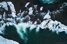 Tröllafossar waterfalls in Iceland in the winter. Long exposure aerial photo captured with a camera drone (Phantom) with aid of a ND16 filter. Tröllafossar means waterfalls of the trolls. Photographer: Paul Oostveen.