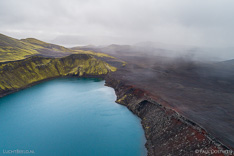 Rainshowers approaching Bláhylur crater lake in Fjallabak in Iceland. Aerial photo captured by drone.