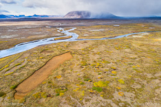 Svarta river and Kjalfell mountain with rain showers in Kjölur in the highlands of Iceland. Aerial photo captured by drone.