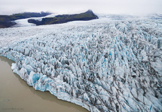 Glacier tongue Fjallsjökull at the edge of glacier lake Fjallsárlón in Iceland. Aerial photo captured with a camera drone by Paul Oostveen.