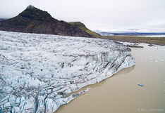 Glacier tongue Fjallsjökull at the edge of glacier lake Fjallsárlón in Iceland. Aerial photo captured with a camera drone by Paul Oostveen.