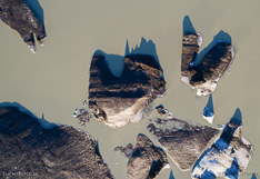 Floating icebergs in the glacier lake in front of Skeiðarárjökull in Iceland. Aerial photo captured with a camera drone (Phantom) by Paul Oostveen.