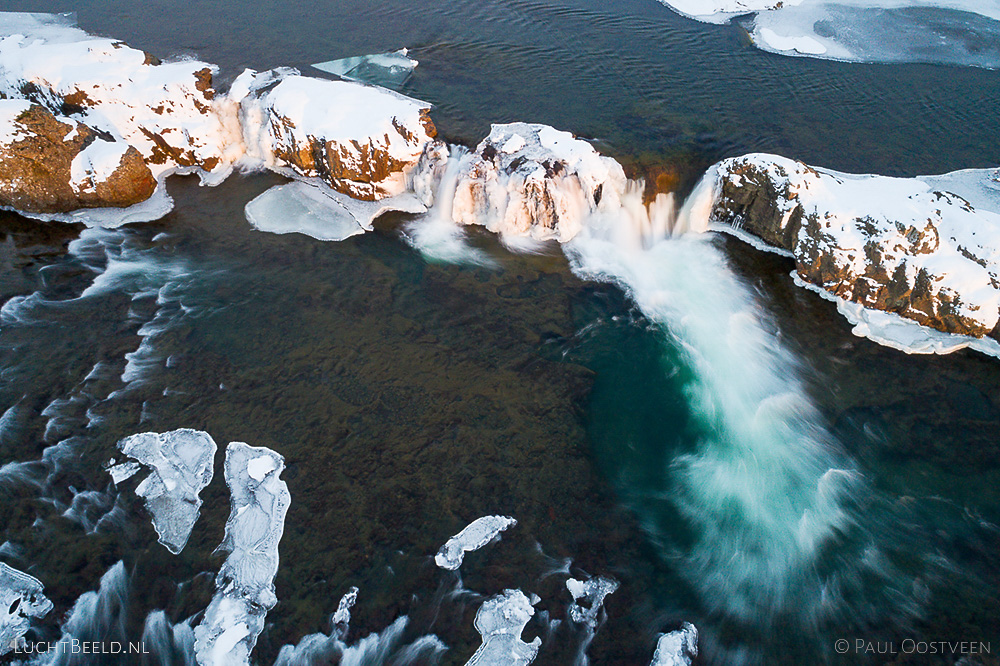 Tröllafossar waterfalls in Iceland in the winter. Long exposure aerial photo captured with a camera drone (Phantom) with aid of a ND16 filter. Tröllafossar means waterfalls of the trolls. Photographer: Paul Oostveen.