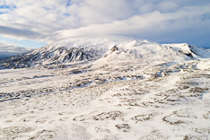 Snæfellsjökull on Snæfellsnes in winter, covered with snow and clouds. Aerial photo captured with a camera drone (Phantom) by Paul Oostveen.