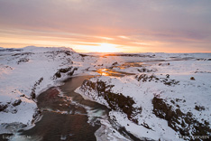Sunset above waterfall Tröllafossar in Iceland in winter. Aerial photo captured with a camera drone (Phantom) by Paul Oostveen.