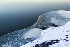 Frozen lake in winter in Iceland. Aerial photo captured with a camera drone (Phantom) by Paul Oostveen.